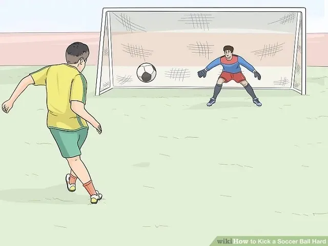 Cầu thủ thực hiện động tác tiếp nối và giữ thăng bằng sau khi sút bóng